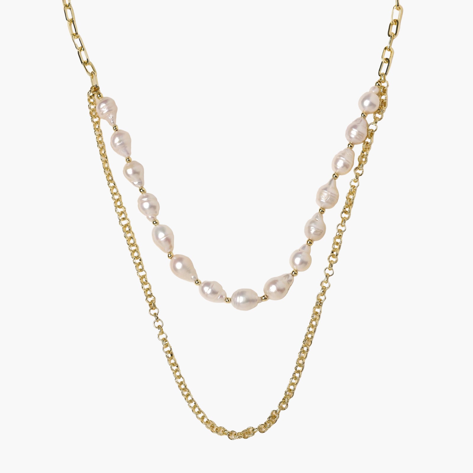 Layered gold chain necklace with organic baroque freshwater pearls and adjustable length on cream background