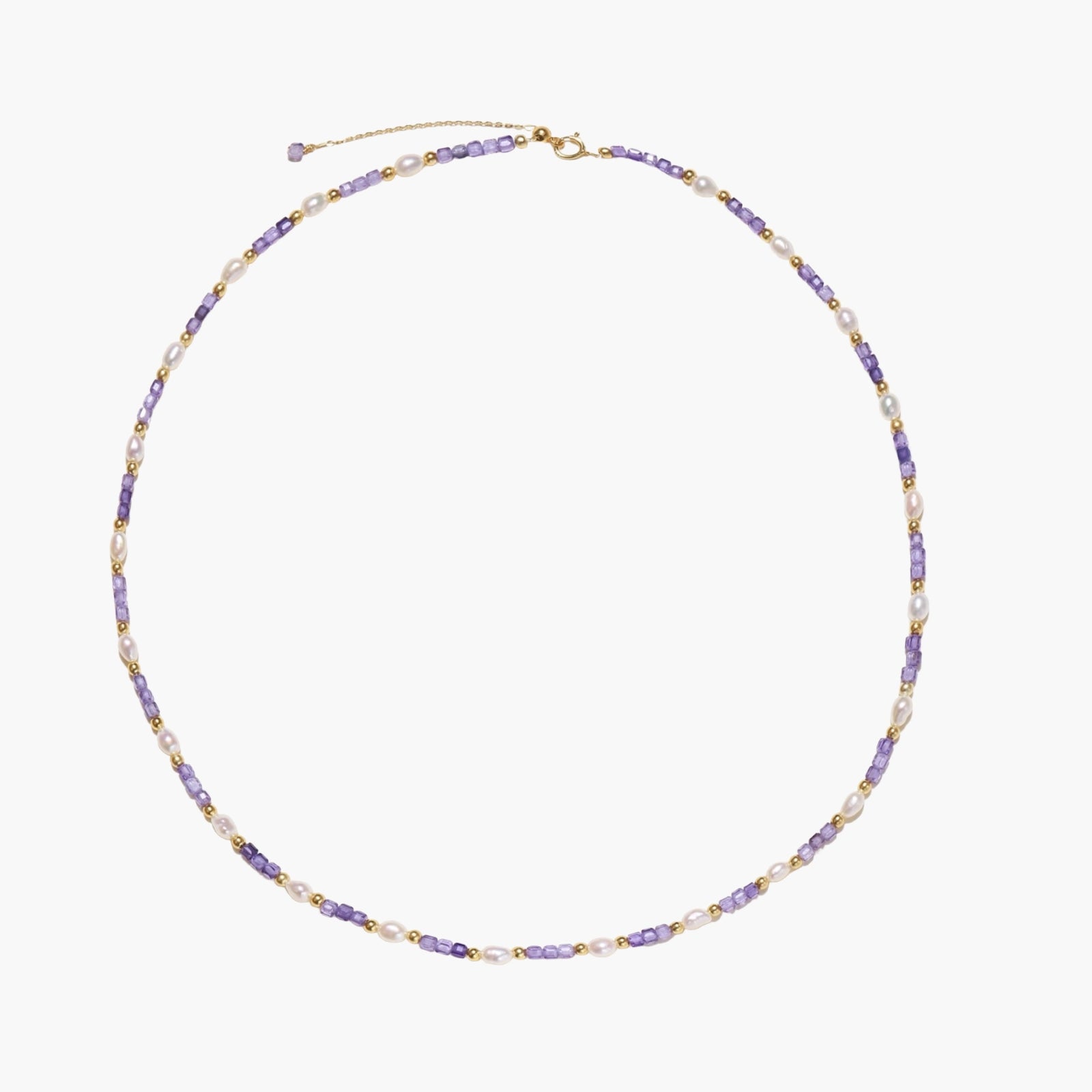 Delicate 18K gold vermeil necklace with alternating lavender zirconia beads and white freshwater pearls on cream background