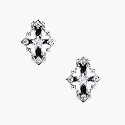 Pair of Art Deco-style stud earrings with star crystals, black enamel accents, and white gold plating on ivory background.