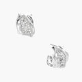 Close-up of sculptural hoop earrings with lattice center band and smooth twisted edges in white gold-plated brass with zirconia