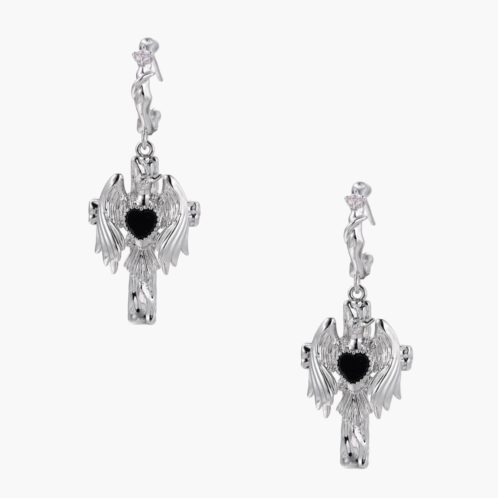 Silver drop earrings with twisted hoops and angel wings embracing black heart locket on white background.