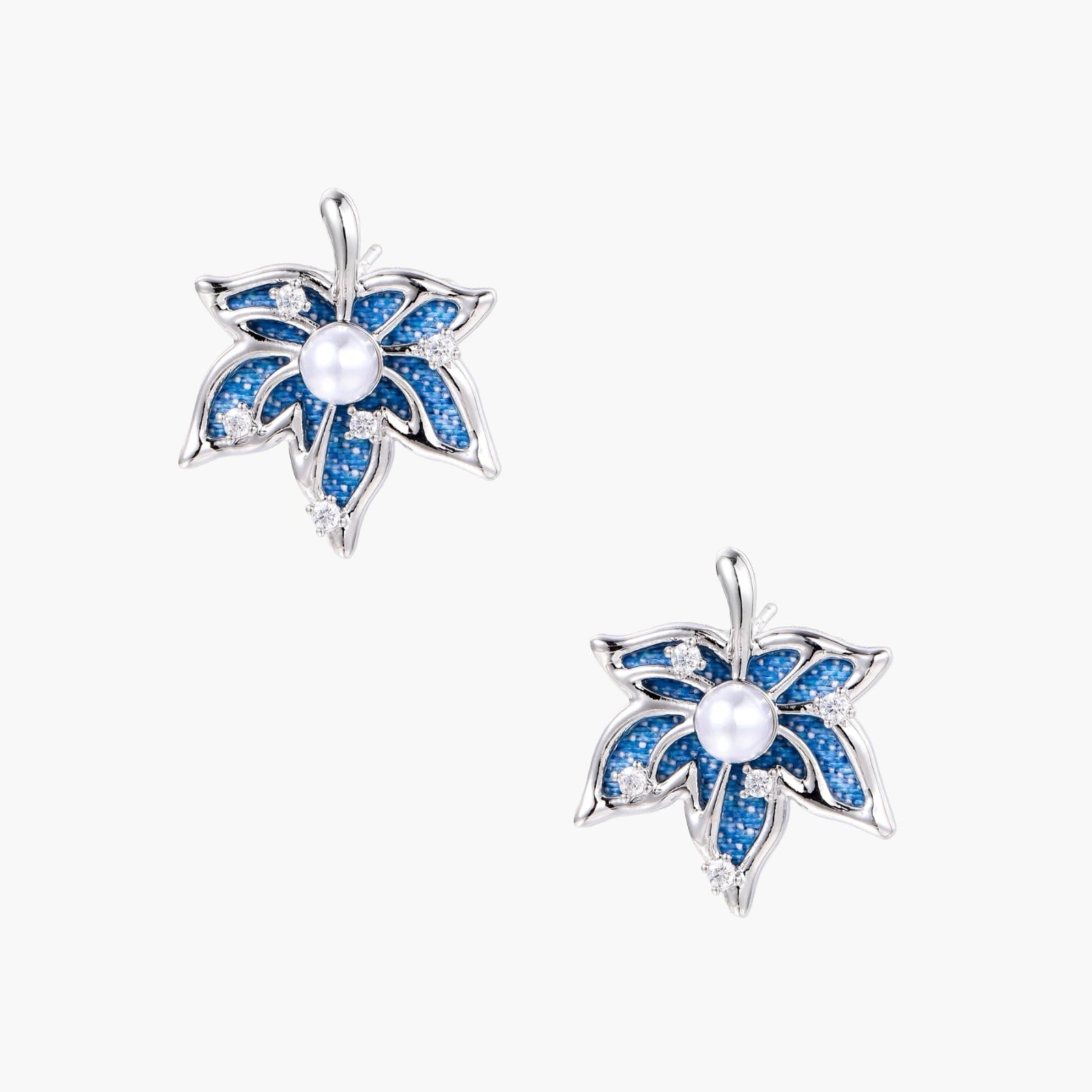 Blue denim fabric star-flower stud earrings with white pearl center and crystal accents on white gold-plated frame