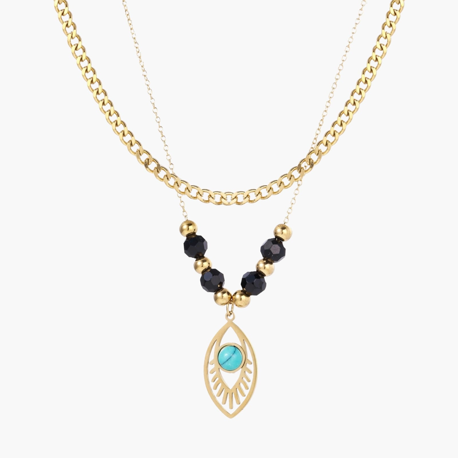Layered gold necklace with turquoise evil eye pendant and black quartz beads on cream background
