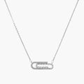 White gold plated necklace with dual-frame geometric pendant featuring crystal pavé border on pale background.