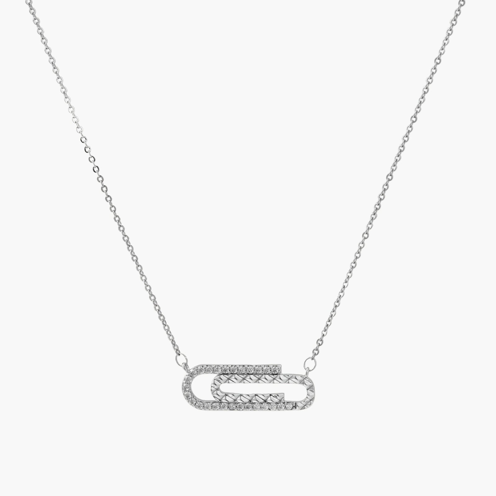 White gold plated necklace with dual-frame geometric pendant featuring crystal pavé border on pale background.