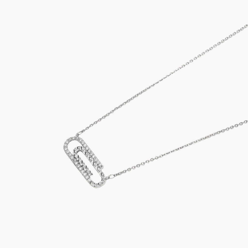 White gold plated necklace with dual-frame geometric pendant featuring crystal pavé border on pale background.