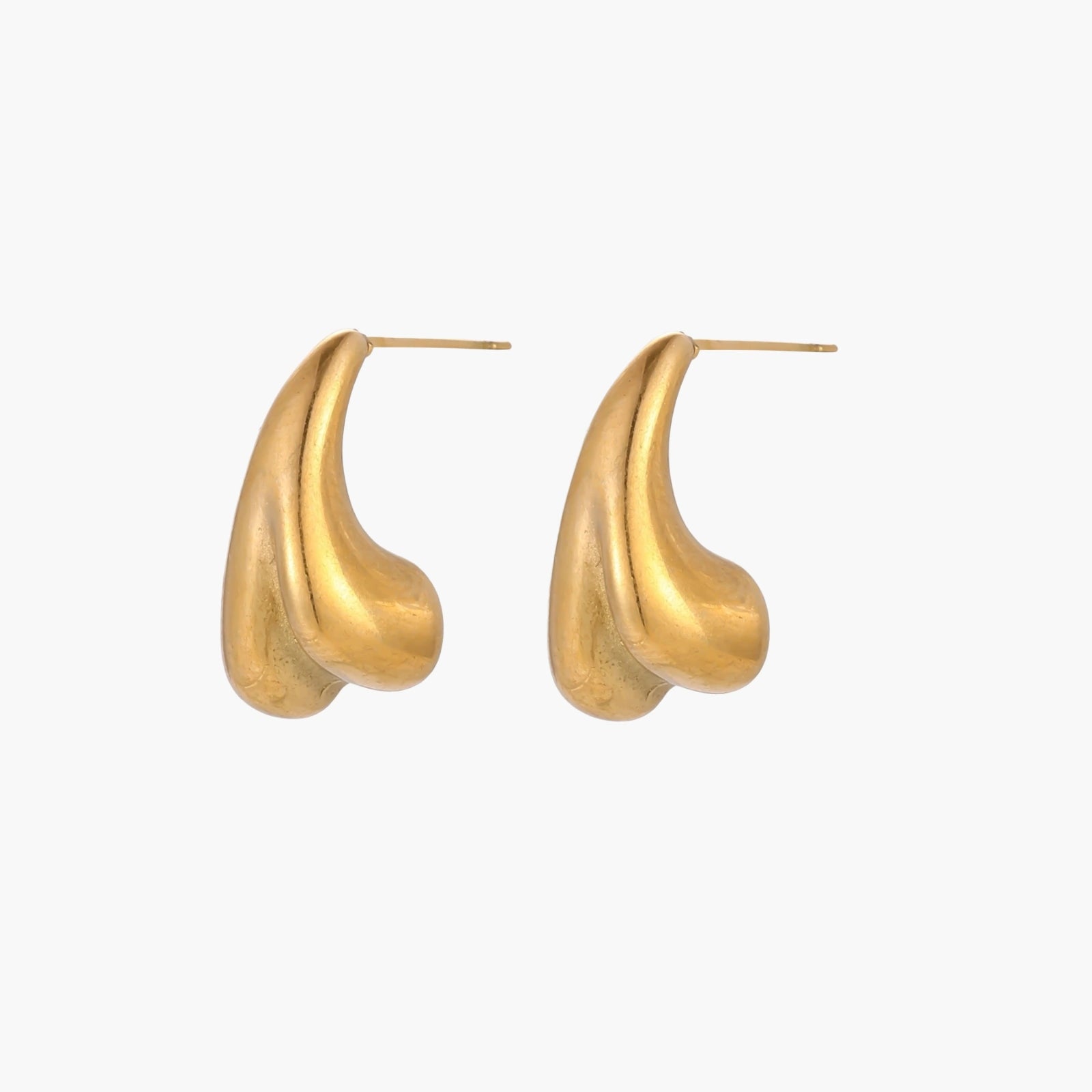 Organic sculptural gold stud earrings with fluid matte finish on cream background